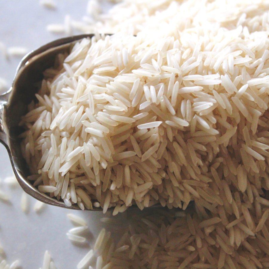 Long-grain polished white Indian Basmati rice in a metal scoop